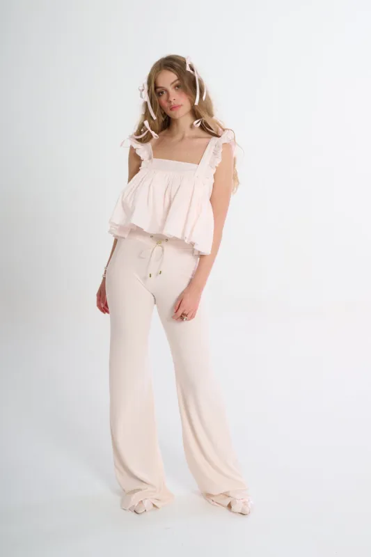 The Lickety Split Ruffle Apron Top sold by Selkie