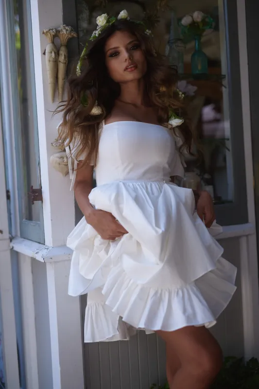 The Ivory Peek A Boo Dress sold by Selkie