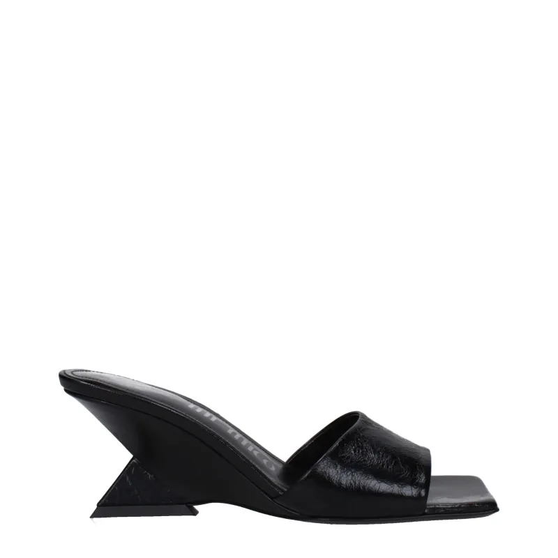 The Attico Black Leather Flat Sandals sold by Siebentaschen