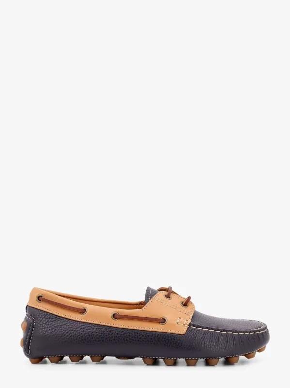 TOD'S Gommino bubble leather lace up boat shoe sold by Siebentaschen