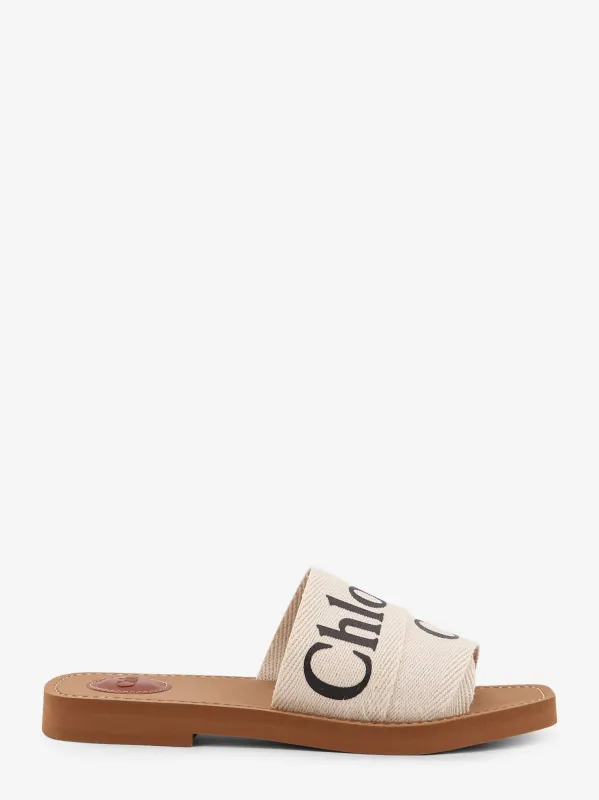 CHLOE' Woody linen flat sandals sold by Siebentaschen
