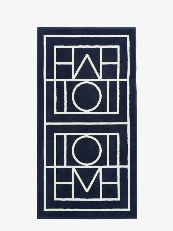 TOTEME Monogram organic cotton beach towel sold by Siebentaschen