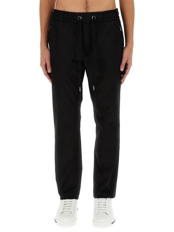 Dolce & Gabbana JOGGING PANTS WITH PLAQUE sold by Siebentaschen