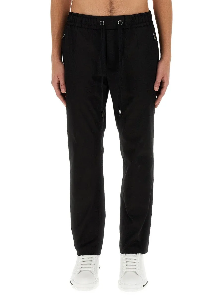 Dolce & Gabbana JOGGING PANTS WITH PLAQUE sold by Siebentaschen