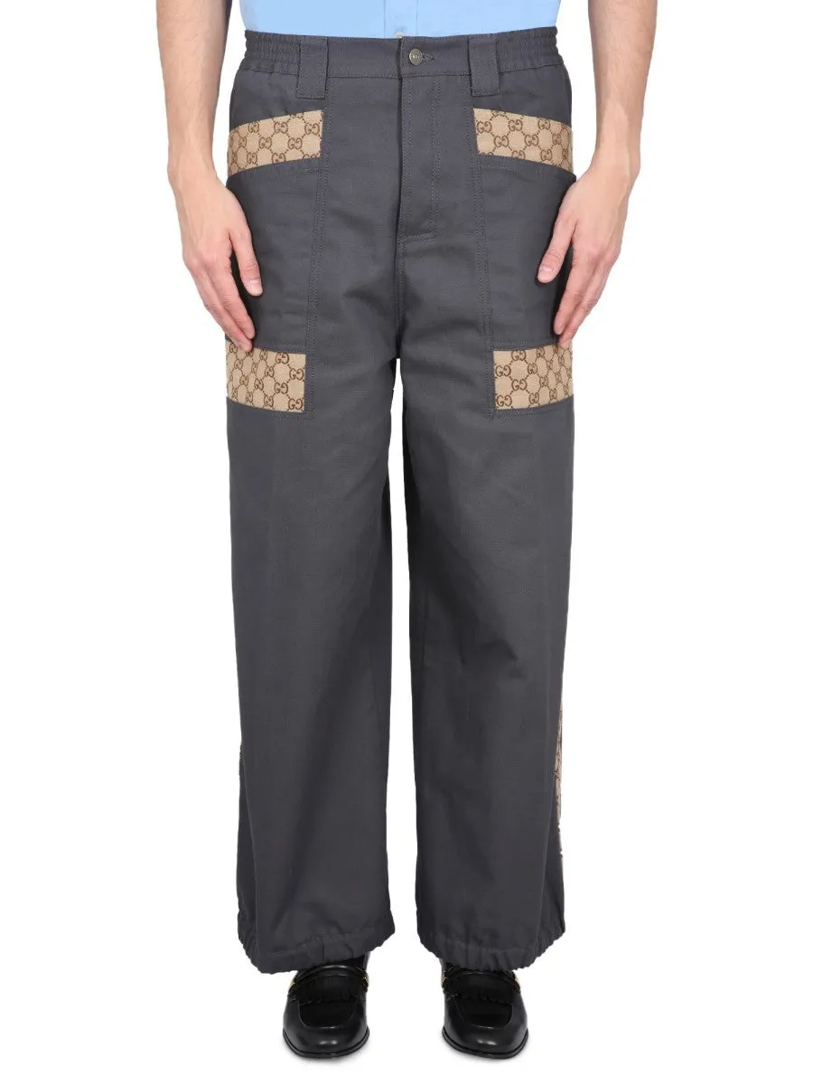 Gucci COTTON FABRIC PANTS WITH GG INSERTS sold by Siebentaschen