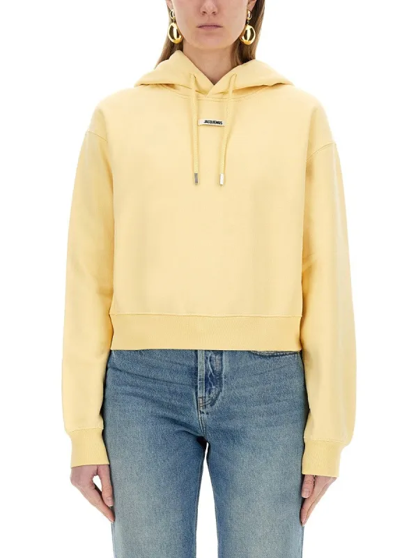 JACQUEMUS "THE SWEATSHIRT" WITH GROSGRAIN HOOD sold by Siebentaschen