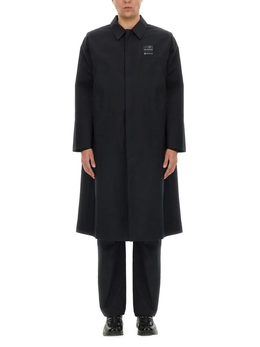 MM6 MAISON MARGIELA X SALOMON TRENCH COAT WITH LOGO sold by Siebentaschen