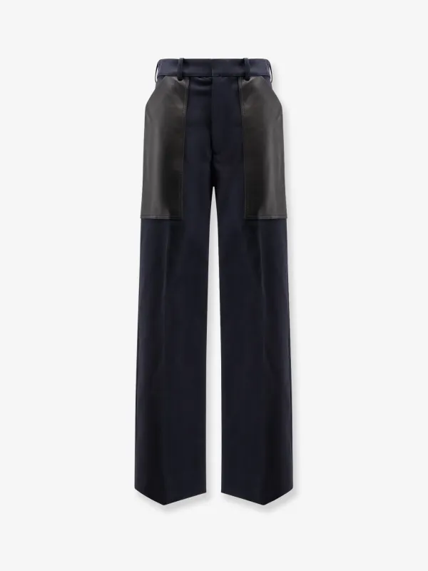 Bottega Veneta Cotton and wool trousers with leather inserts sold by Siebentaschen