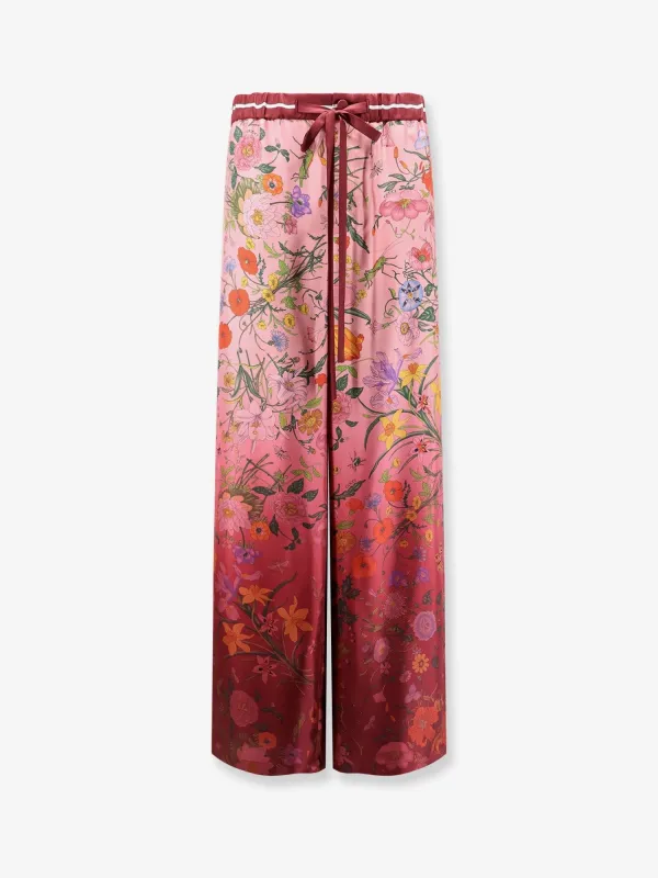 Gucci Silk trousers with Gucci Flora print sold by Siebentaschen