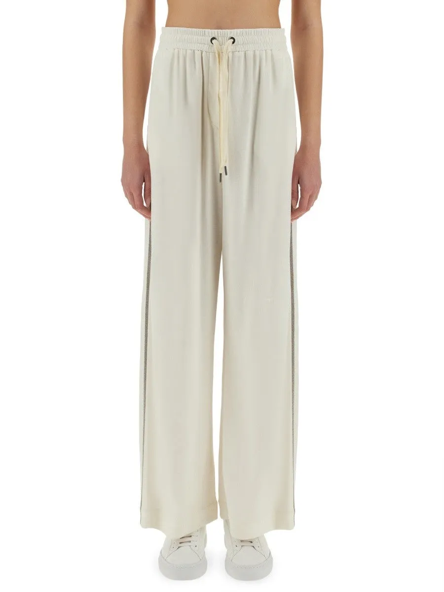 Brunello Cucinelli TRACK PANTS WITH NECKLACE sold by Siebentaschen