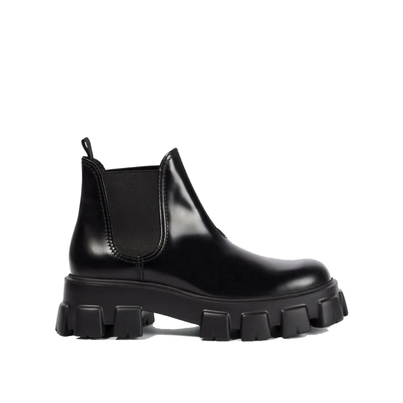 Prada Monolith Leather Ankle Boots sold by Siebentaschen