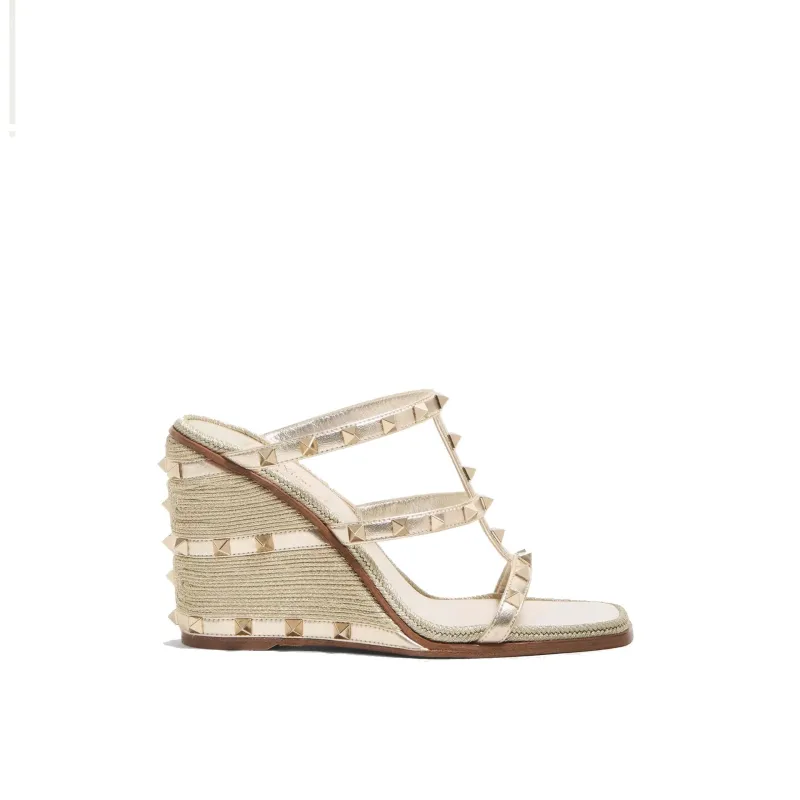Valentino Garavani Women’s Rockstud Wedge Mules sold by Siebentaschen