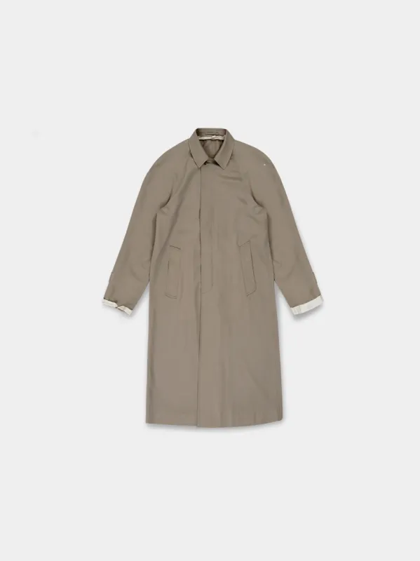 The “Lien” Virgin Wool Coat in gilded beige sold by vuja dè