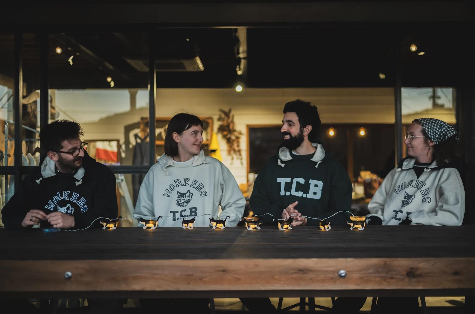 Workers & TCB. Added-on hoodie sweatshirt sold by TCB Jeans
