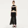 Avril Ruffled Chiffon Sleeveless Top in Black sold by PANN