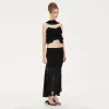 Avril Ruffled Chiffon Sleeveless Top in Black sold by PANN