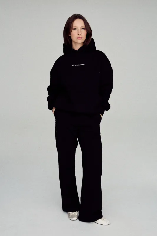 signature tracksuit pants - black sold by With Consideration