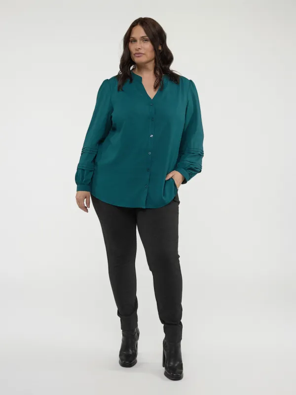 Long-sleeve semi-fitted blouse with buttons sold by Claire France