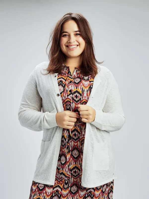 Loose knit cardigan sold by Claire France