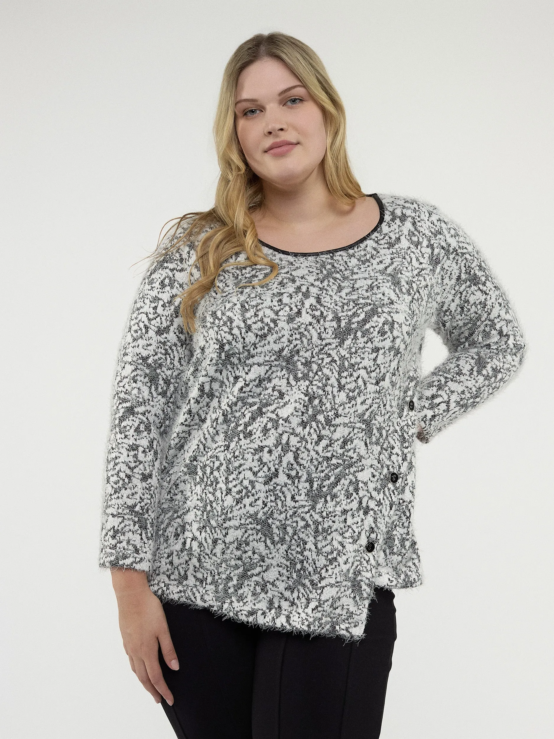 Long-sleeve semi-fitted knit tunic sold by Claire France