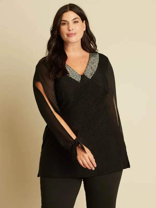 Long-sleeve semi-fitted knit tunic sold by Claire France