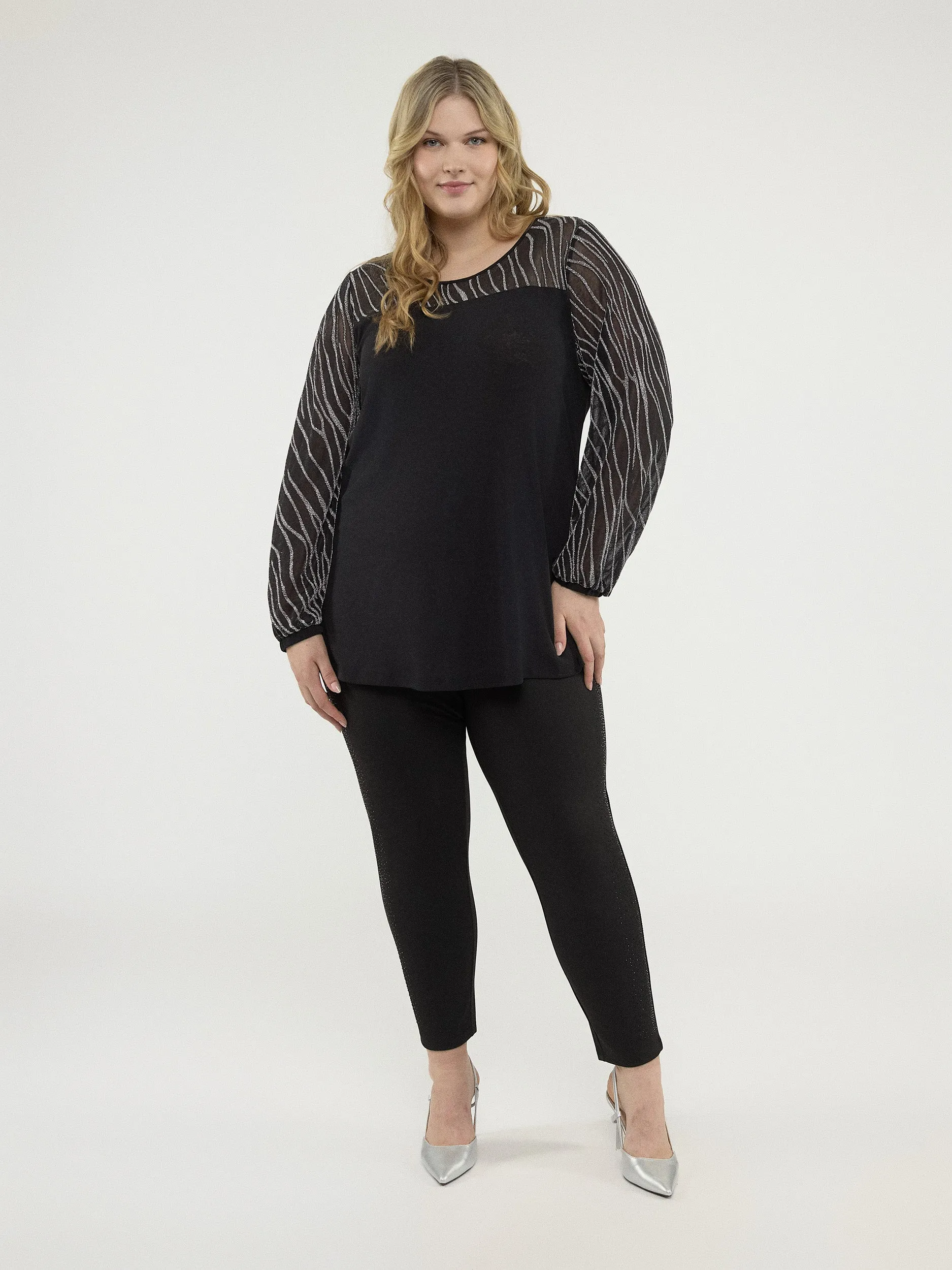 Long-sleeve semi-fitted knit tunic sold by Claire France