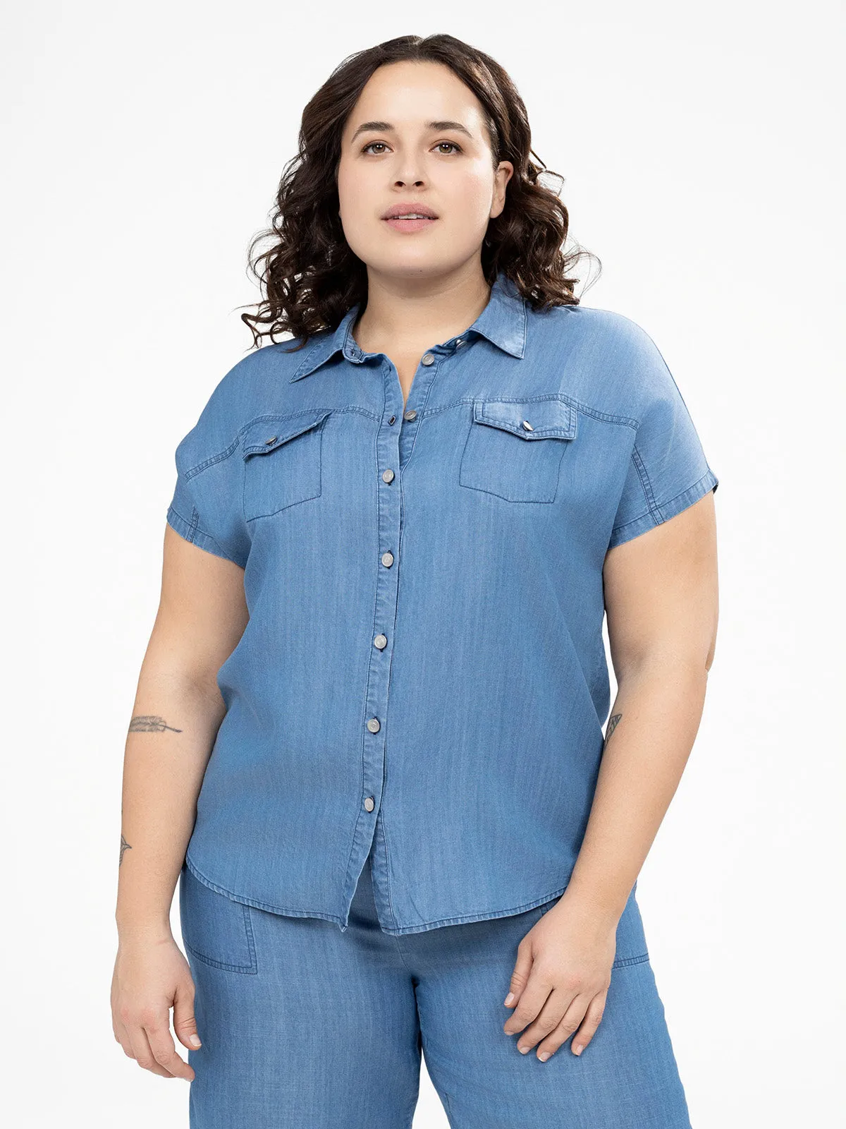 Short-sleeve semi-fitted blouse with buttons sold by Claire France