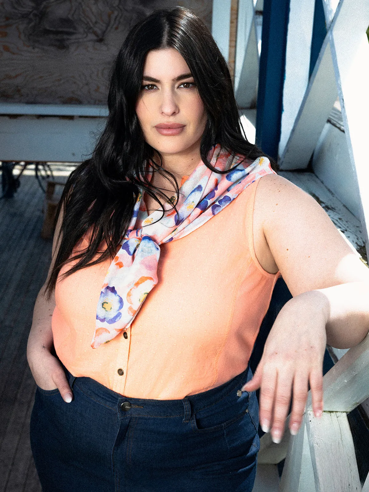 Sleeveless semi-fitted blouse with buttons sold by Claire France