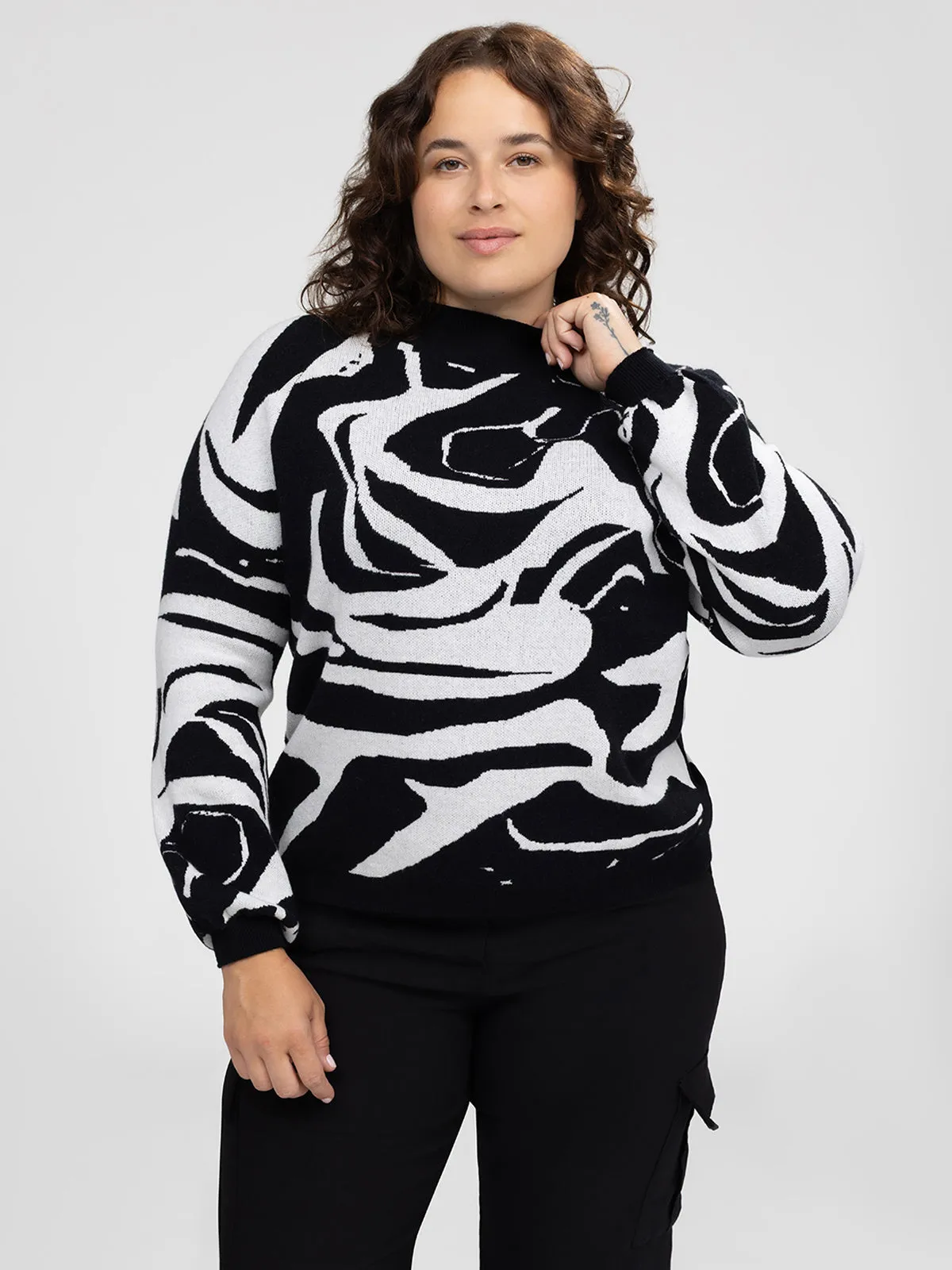 Long-sleeve loose pullover sweater sold by Claire France