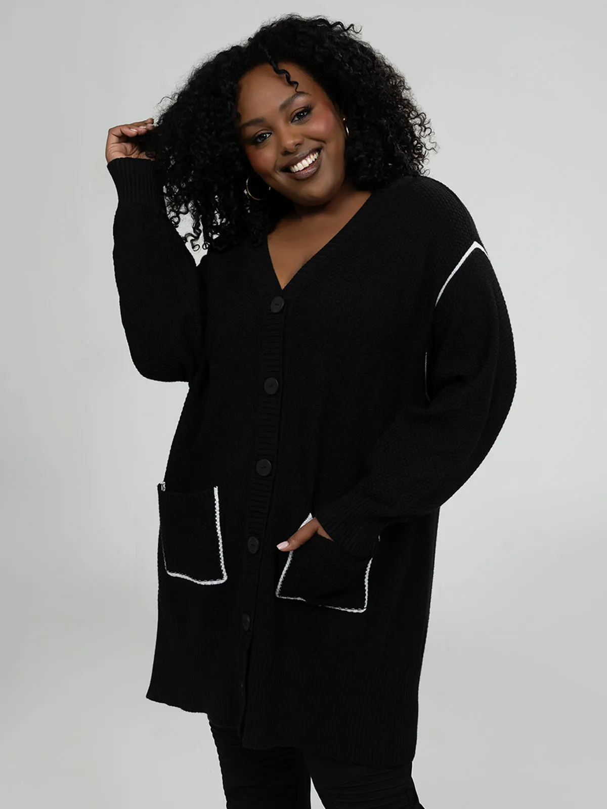 Semi-fitted sweater cardigan sold by Claire France