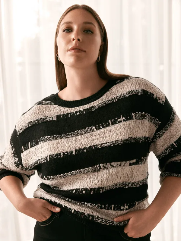 Long-sleeve loose pullover sweater sold by Claire France