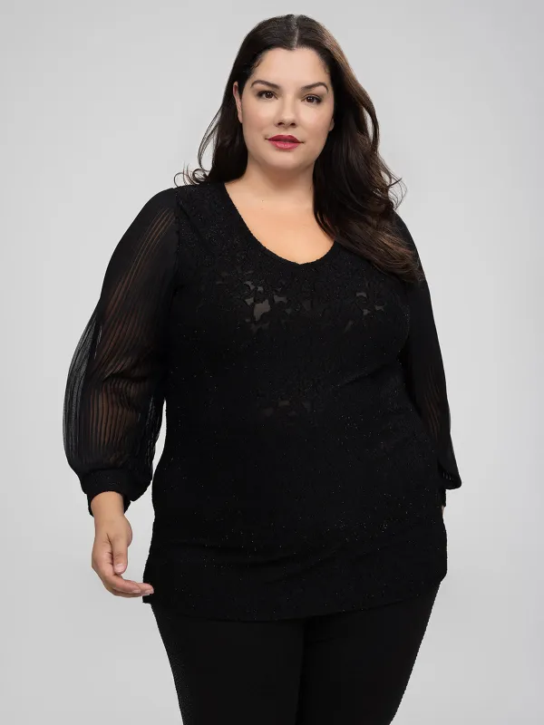 Long-sleeve semi-fitted knit tunic sold by Claire France