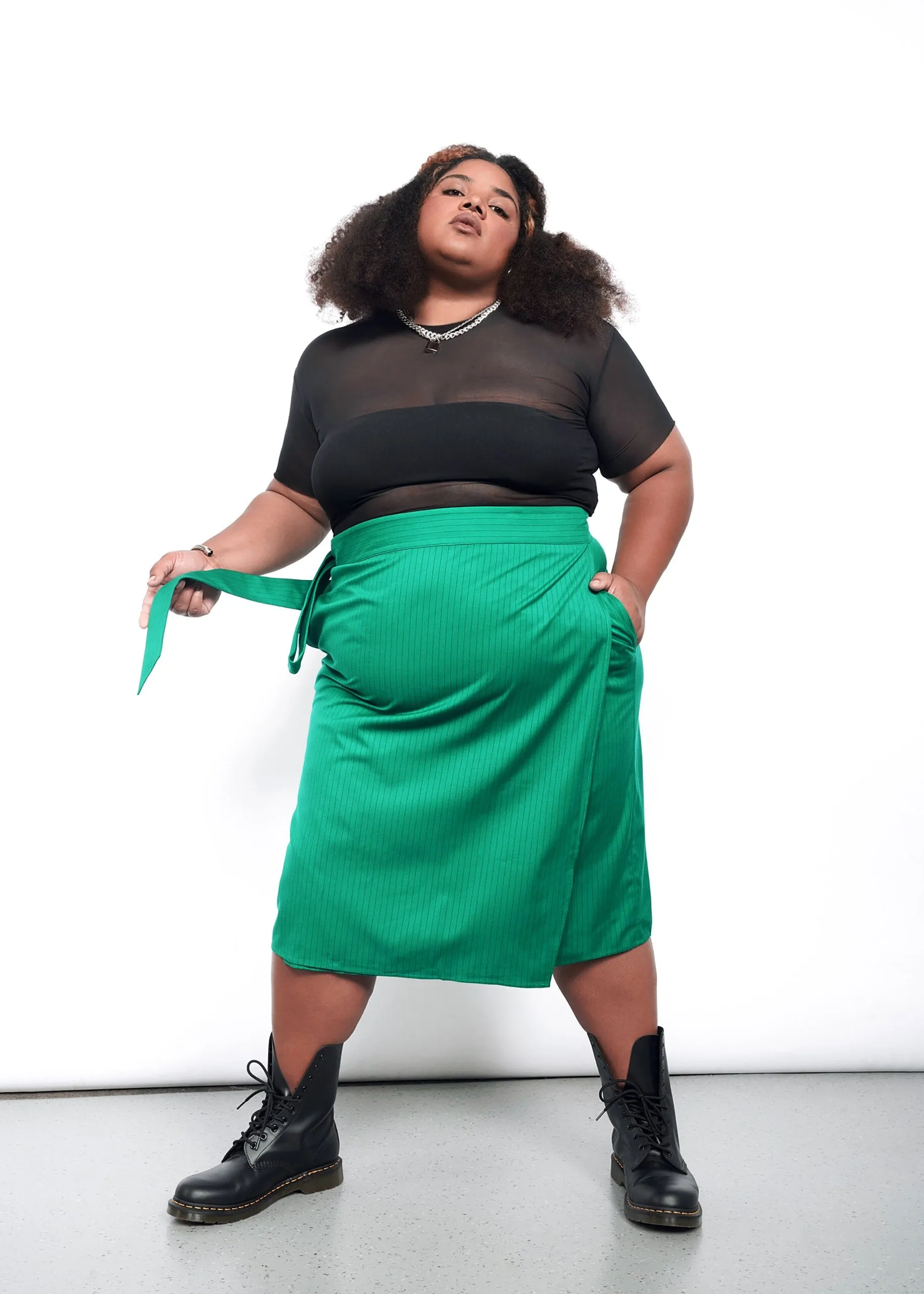 The Empower Pinstripe Wrap Skirt sold by WILDFANG