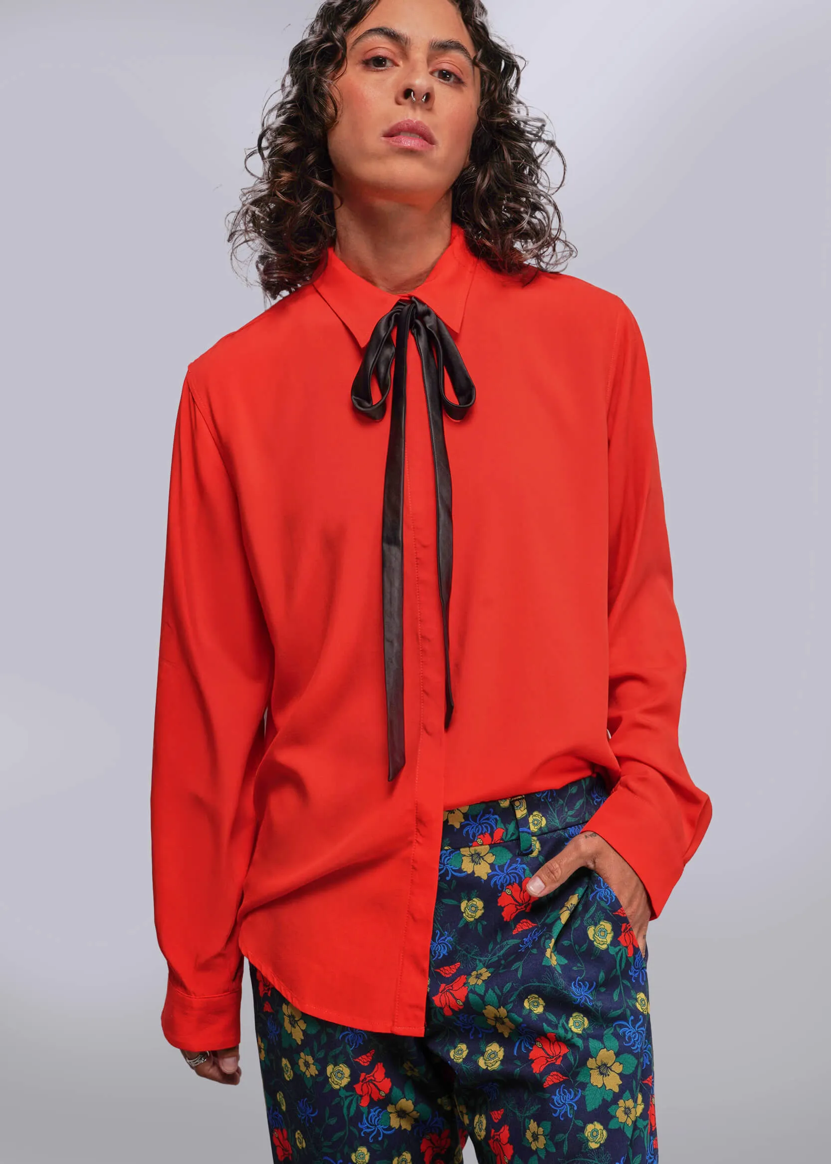 The Empower Long Sleeve Bow Button Up sold by WILDFANG