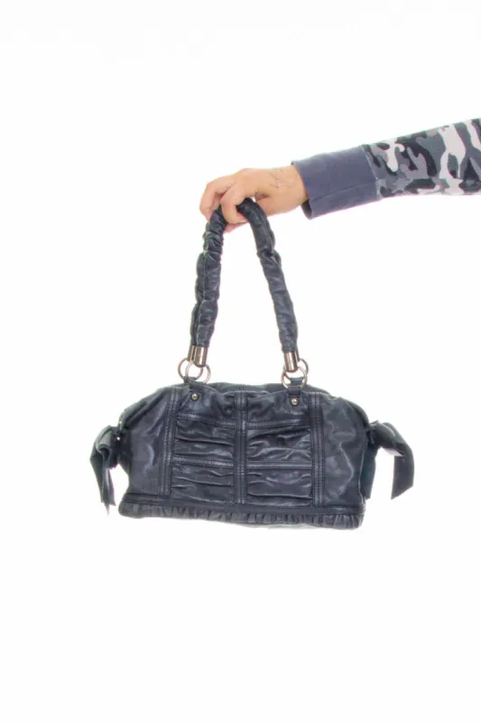 Vintage Y2K Bebe Black leather Bow Bag sold by Tunnel Vision