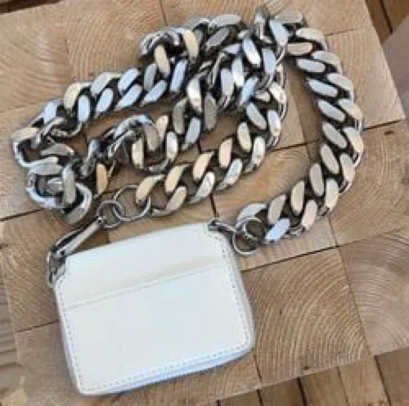 White crossbody bag sold by Sante Grace