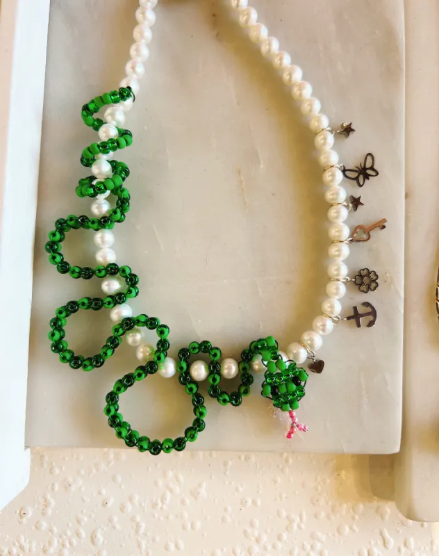 Snake and Pearls necklace sold by Nooworks