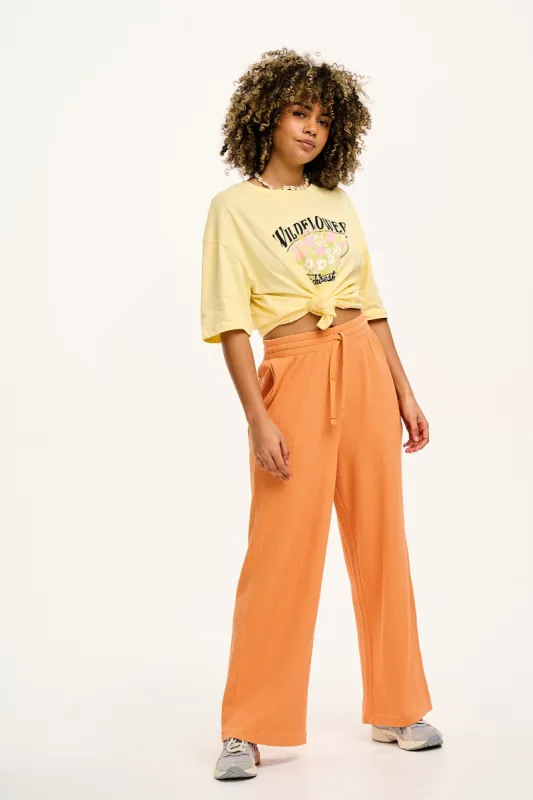 Larson - Wide Leg Waffle Cotton Joggers in Sunset Orange sold by Lucy & Yak