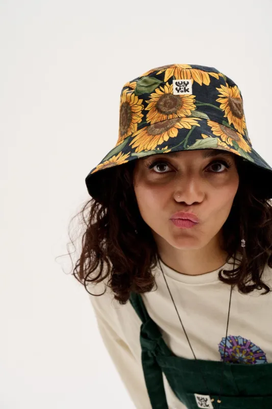 Travis - Reversible Cotton Bucket Hat in Sunflower Print & Black sold by Lucy & Yak