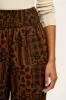 Alexa - Cotton Trousers in Brown Penny Patchwork Print sold by Lucy & Yak
