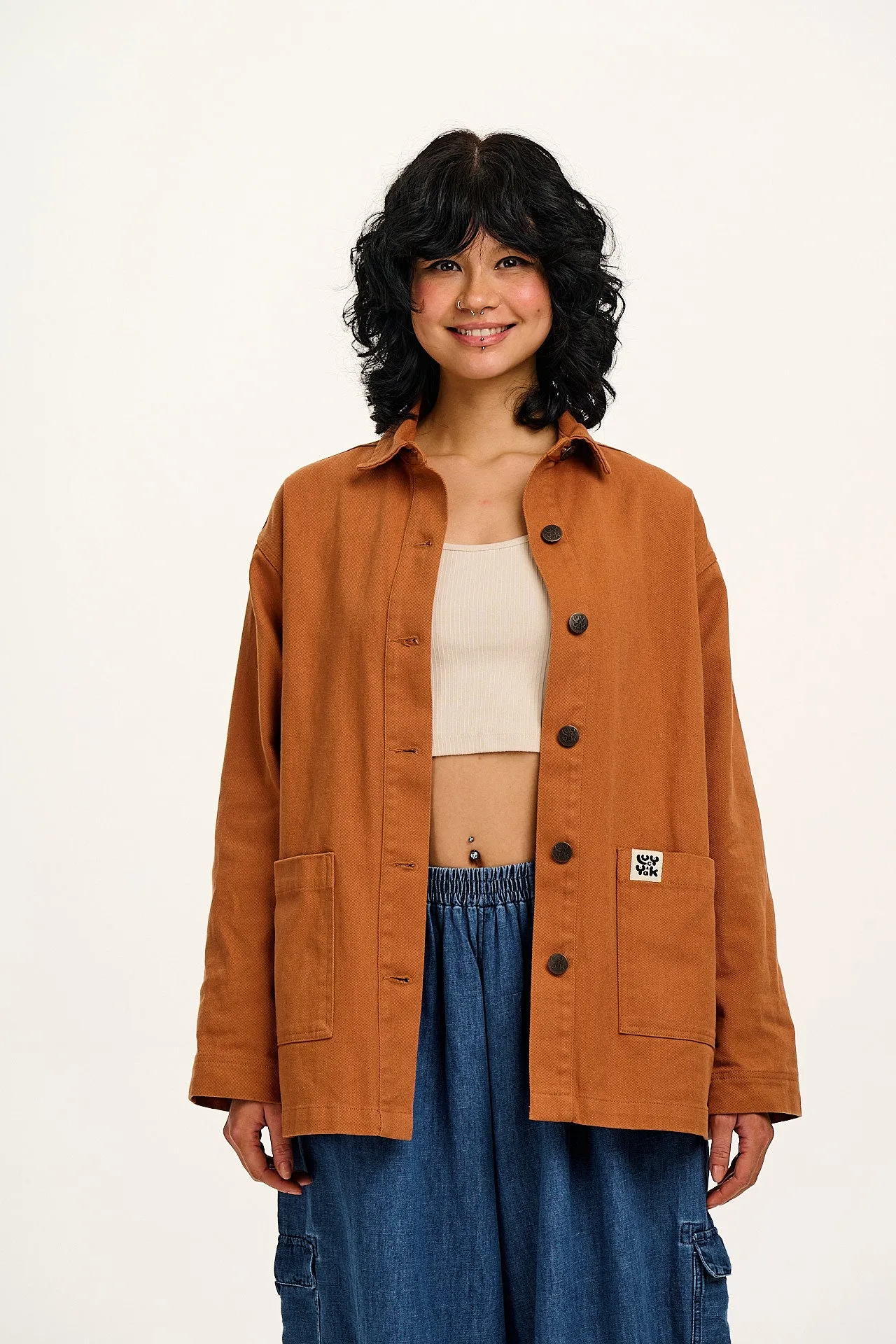 Olly - Cotton Jacket in Amber Orange sold by Lucy & Yak