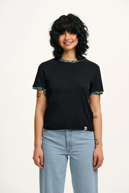 Maya - Cotton T-Shirt in Black with Ditsy Floral Print sold by Lucy & Yak