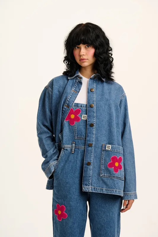 Olly - Denim Jacket in Mid Wash Blue with Pink Flower Motif sold by Lucy & Yak