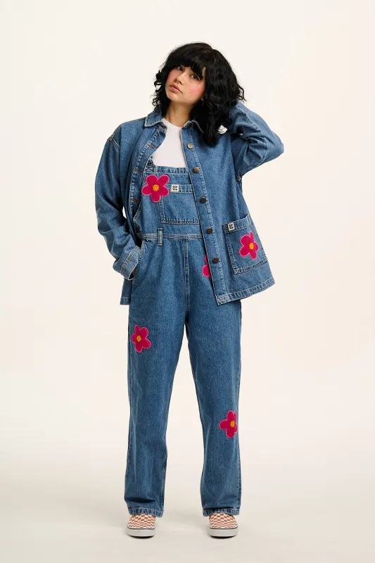 Easton - Denim Dungarees in Mid Wash Blue with Pink Flower Motif sold by Lucy & Yak