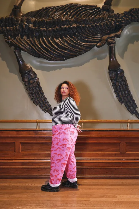 L.E. Alexa - Cotton Trousers in Pink Dinosaur Natural History Museum & Yak sold by Lucy & Yak