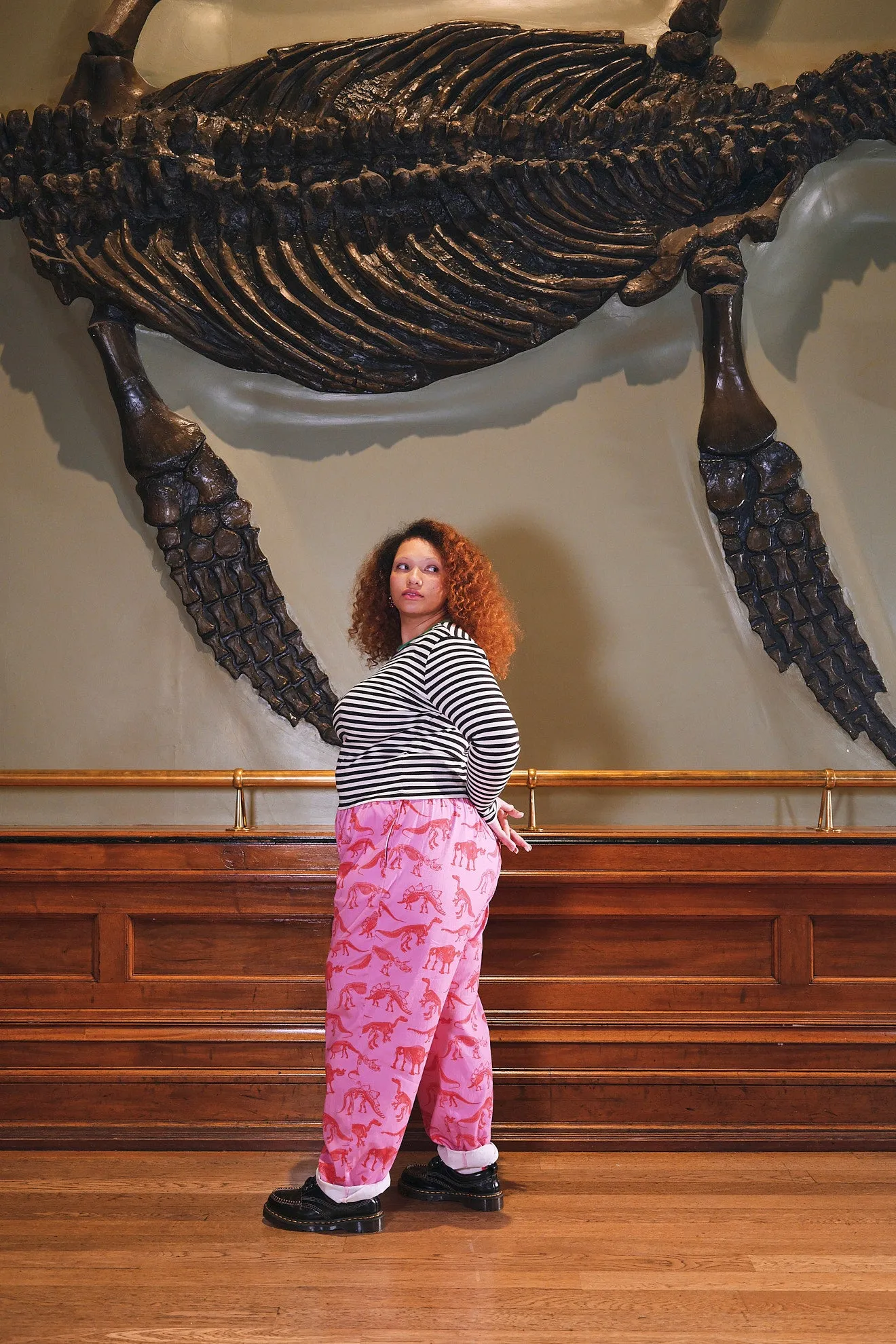 L.E. Alexa - Cotton Trousers in Pink Dinosaur Natural History Museum & Yak sold by Lucy & Yak