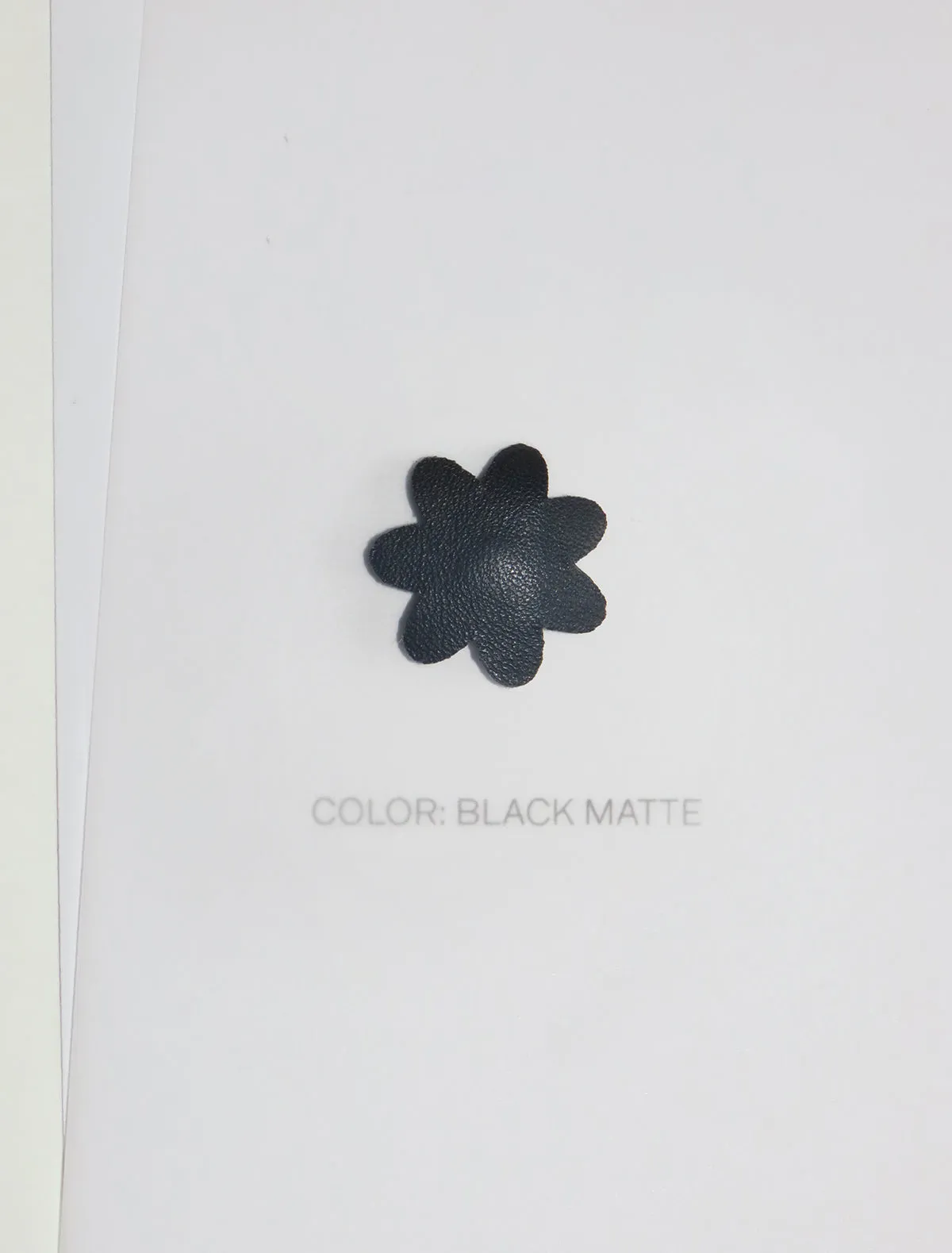 Leather flower snap - black matte sold by Paloma Wool