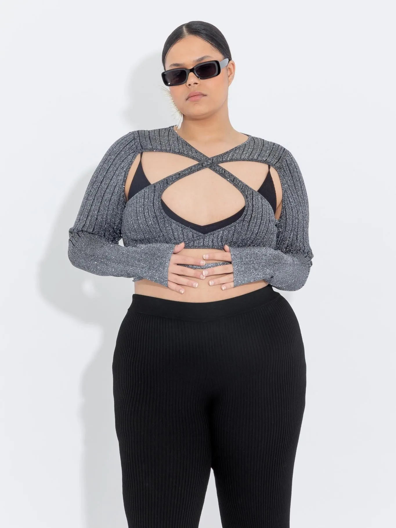 Black Lurex Peephole Wrap Top sold by Ester Manas