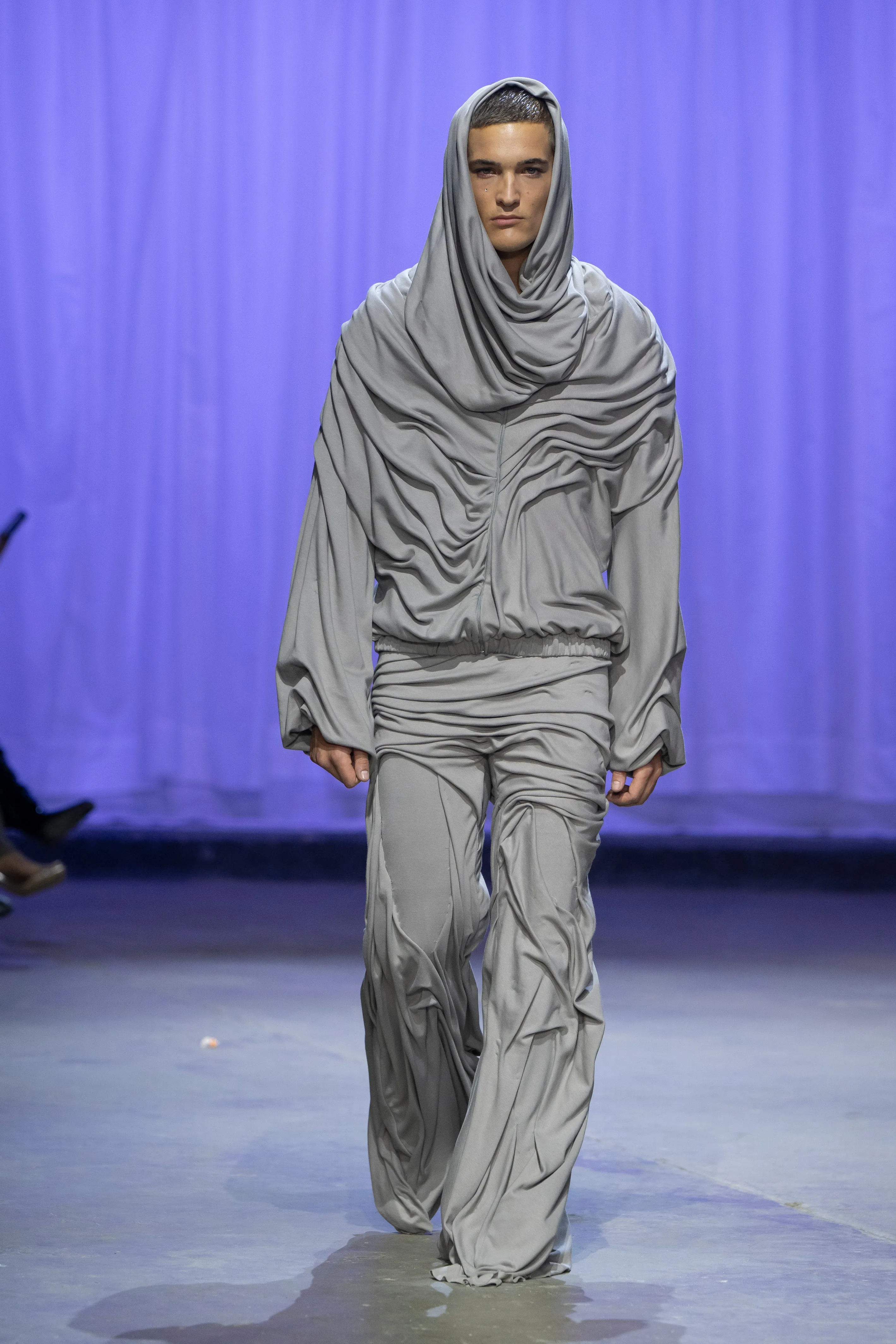 Wetlook Draped Flared Trousers sold by Di Petsa