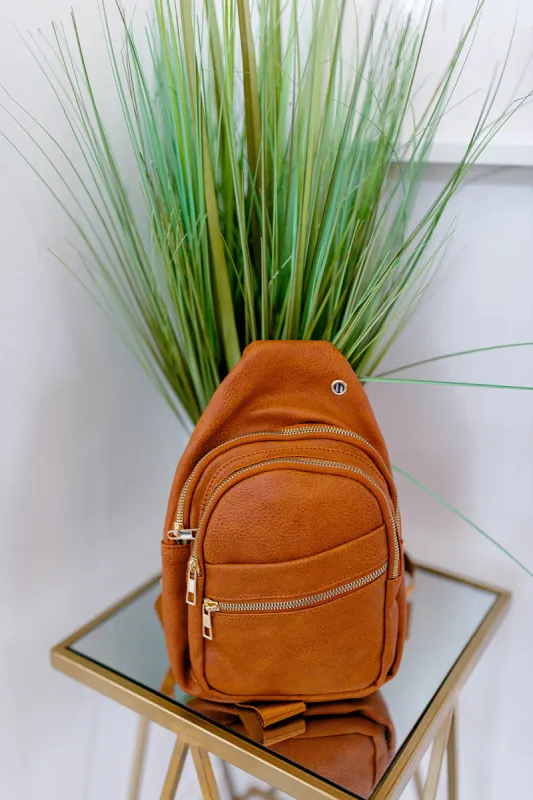 Follow Your Own Path Sling Bag In SADDLE*** RESTOCKED*** sold by shop taby